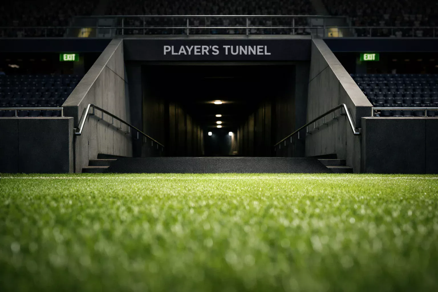 View of a football stadium tunnel entrance from the pitch, players preparing to return for second half